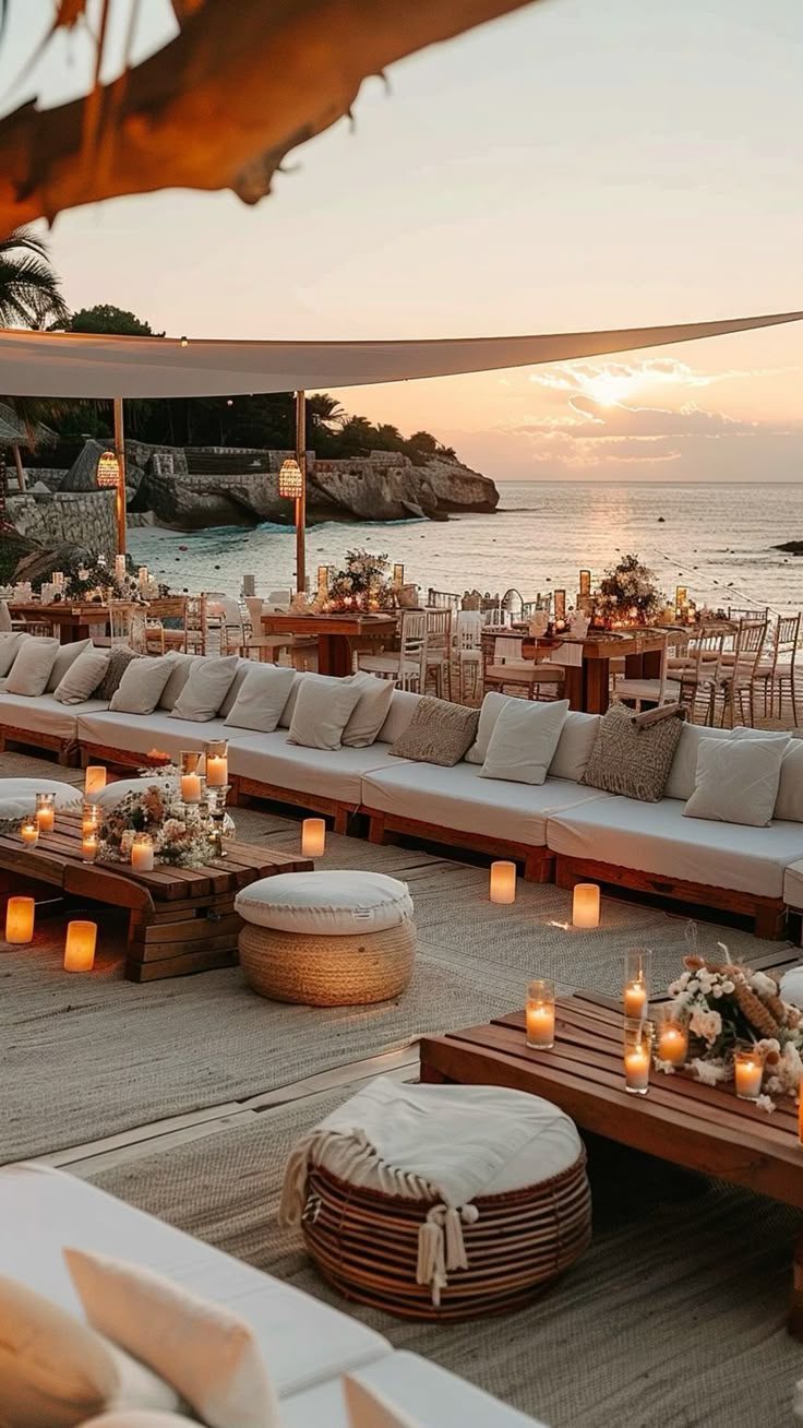 Candlelit beach lounge at sunset